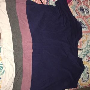 A blue shirt with pink grey and white stripe